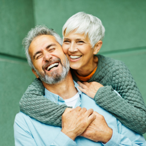 Two Senior Citizens smiling 